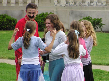 Gabrielle Reisman demonstrates how best to escort Ernie Springer through the crowd