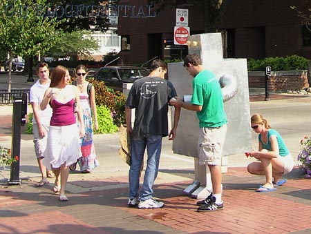 Pedestrians encounter RobotMan in Campustown