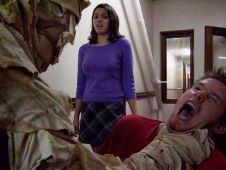 Jo-Ann (Andrea Gordon) sneers at The Mummy, Ted Johnson.