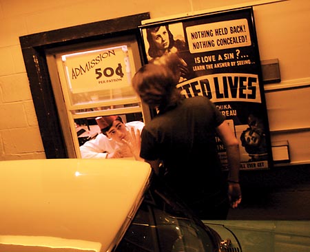 Daniel Griffith instructs a ticket-taking actor in a reenactment for THE WONDER WORLD OF K. GORDON MURRAY.